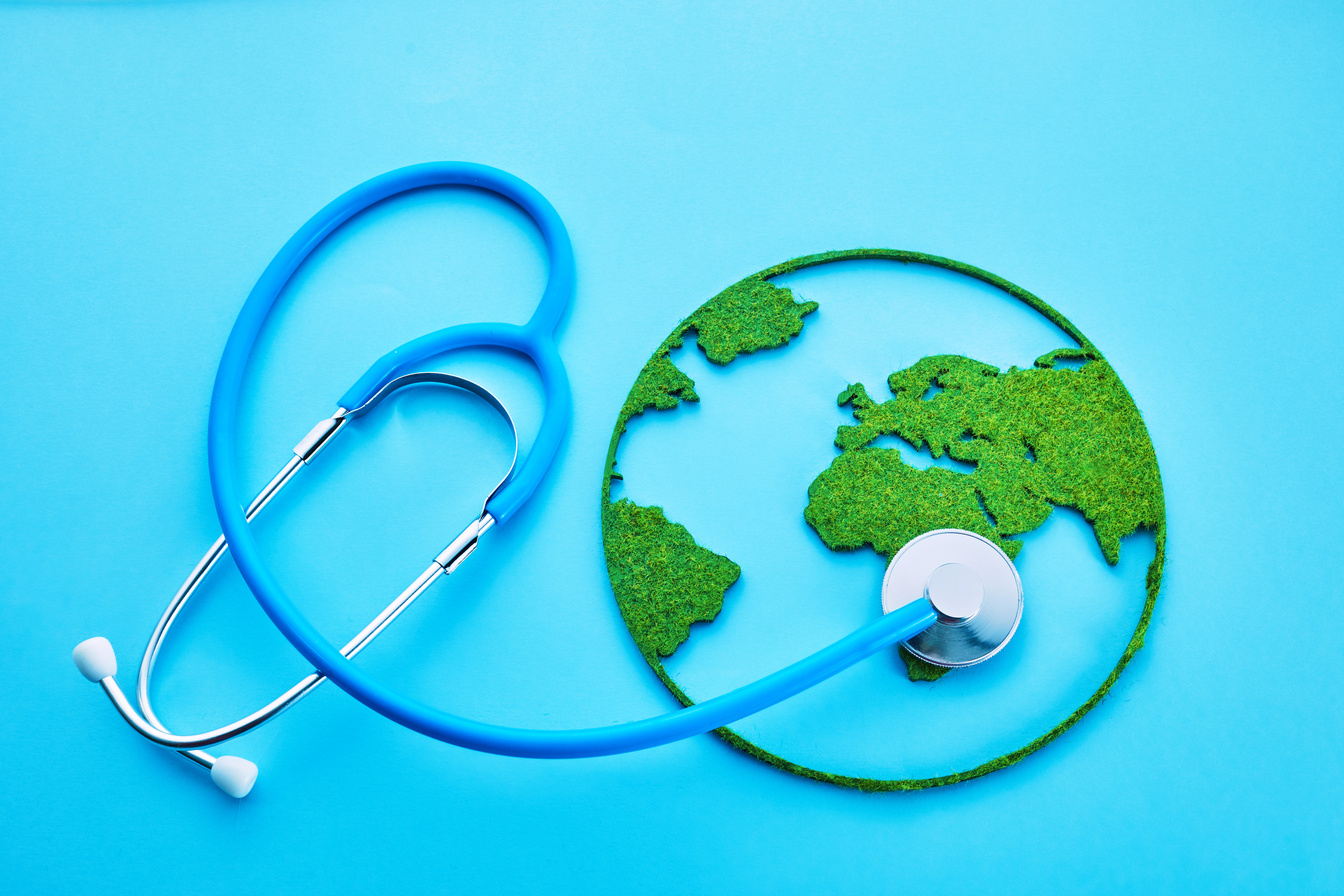 World Health Day. Global Health Awareness Concept. Globe and Stethoscope on Blue Background.